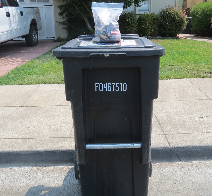 Batteries on top of a garbage can for recycling in san mateo county, ca