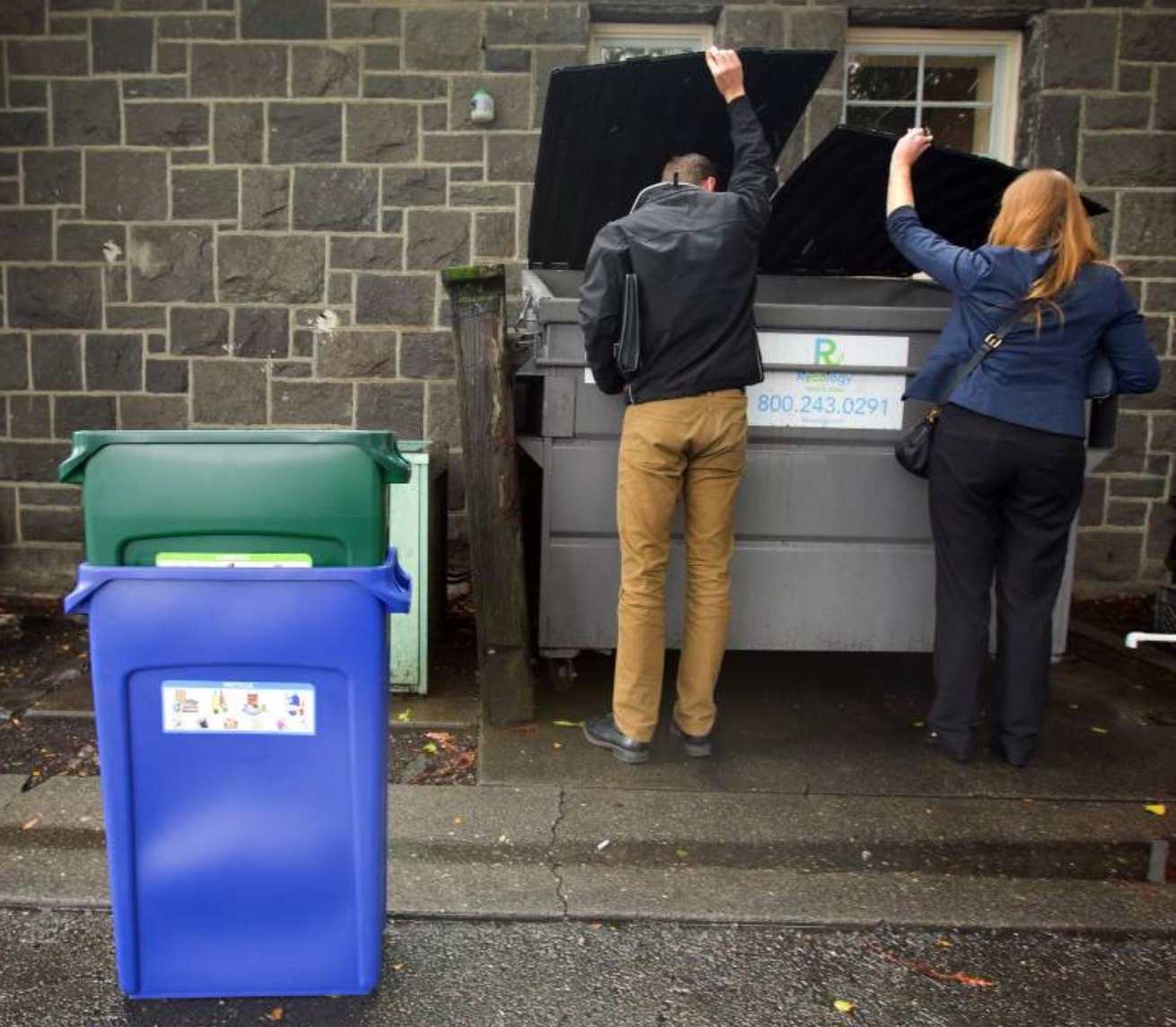 Looking in bin Recology Sonoma Marin